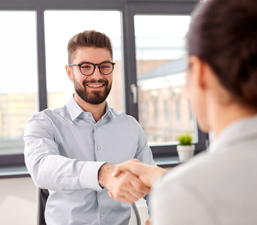 A newly hired employee shaking hands