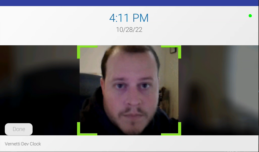 example of an employee looking at the iris time clock camera to check in