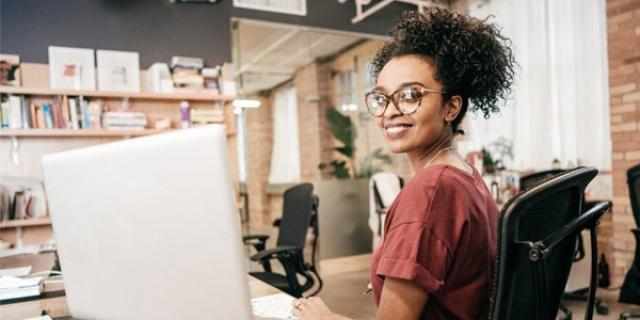 An employee working at her desk