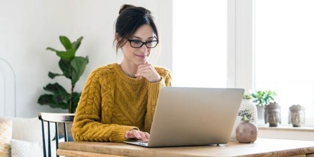 A new employee working on her onboarding forms