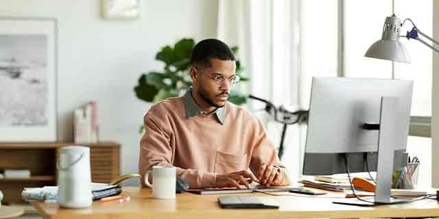 Business owner looking at his computer