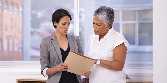 Business owner talking with an employee