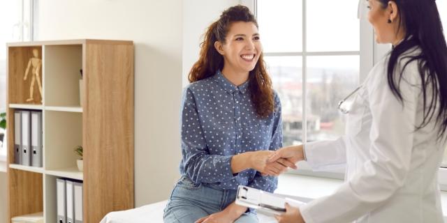 friendly physician greeting her new patient