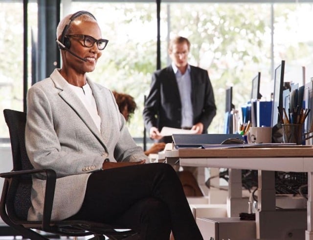 an HR advisor talking on the phone with a client