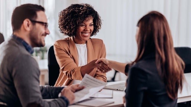 two employers in an interview with a candidate