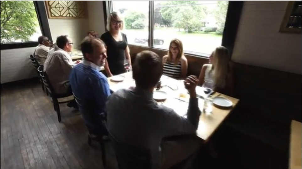 patrons seated at a restaurant for a meal