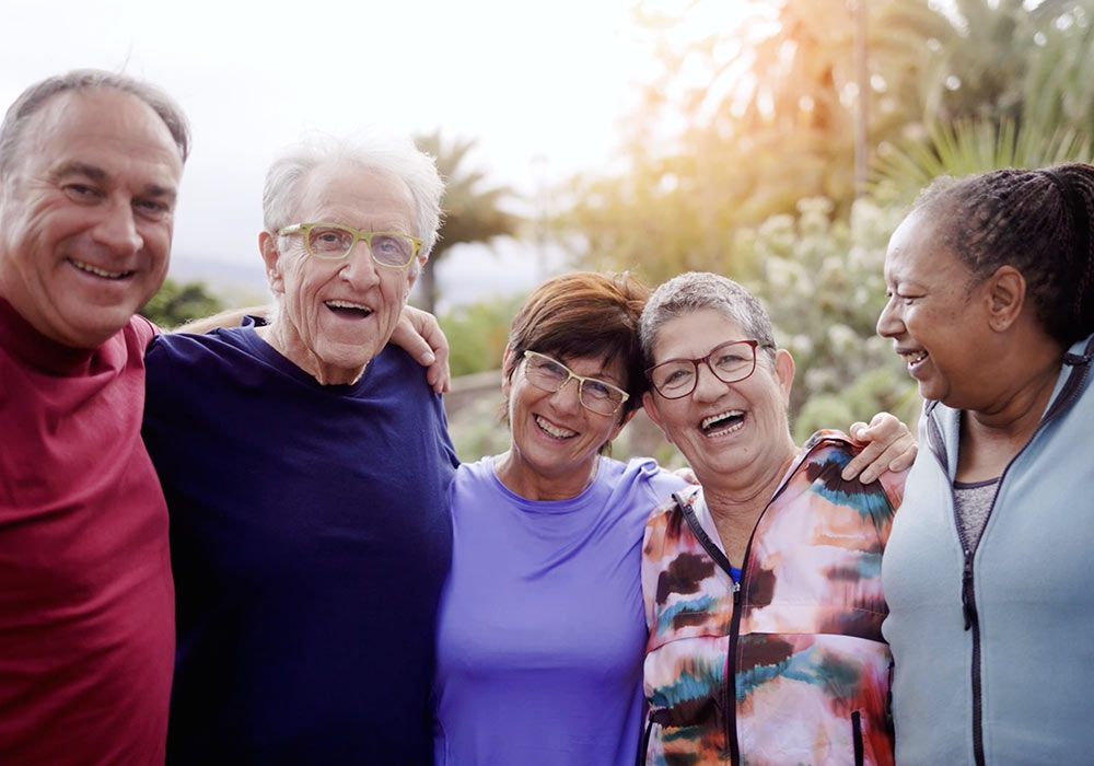 active senior citizens laugh outside